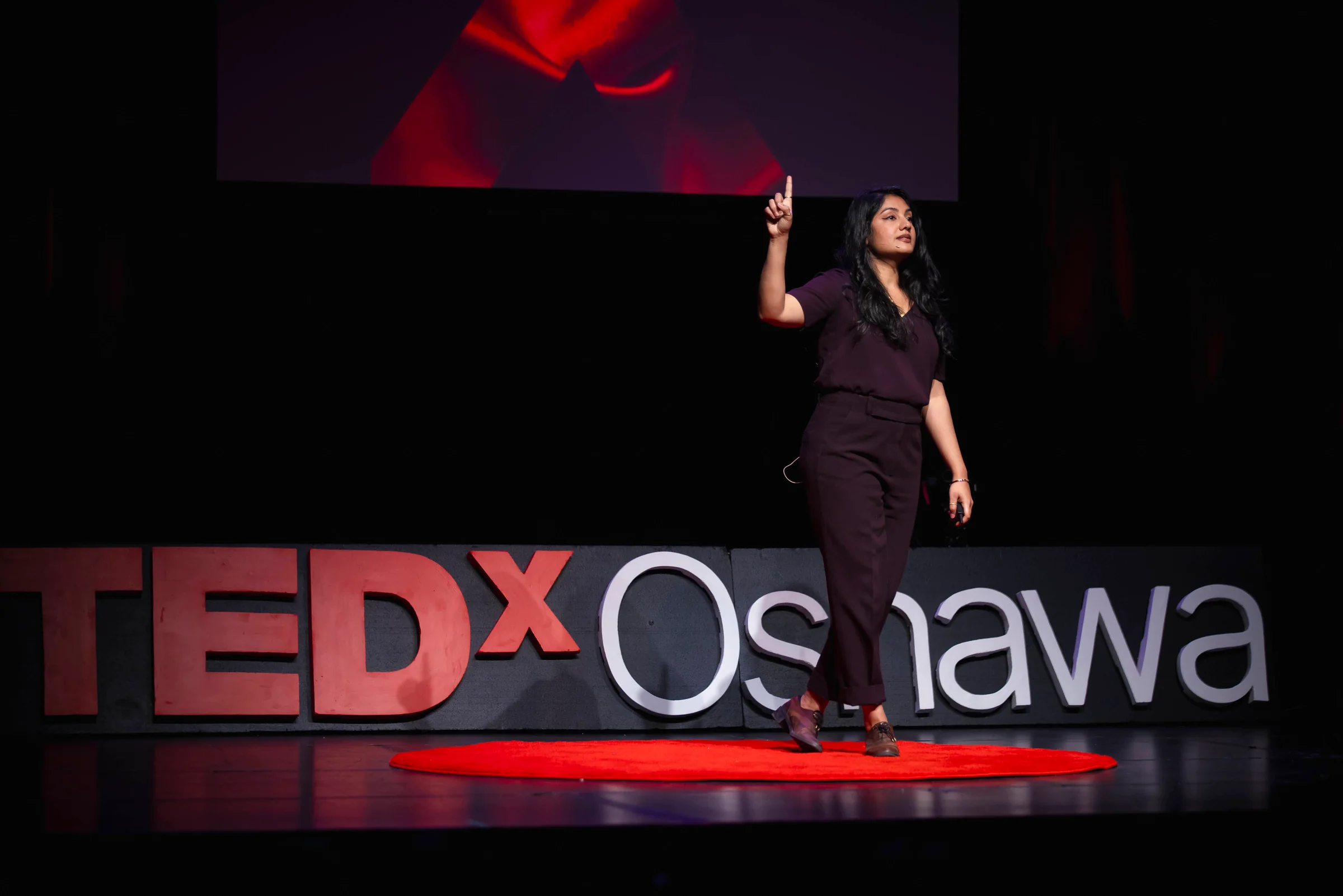 Dr. Anne Hussain delivering her TEDxOshawa keynote